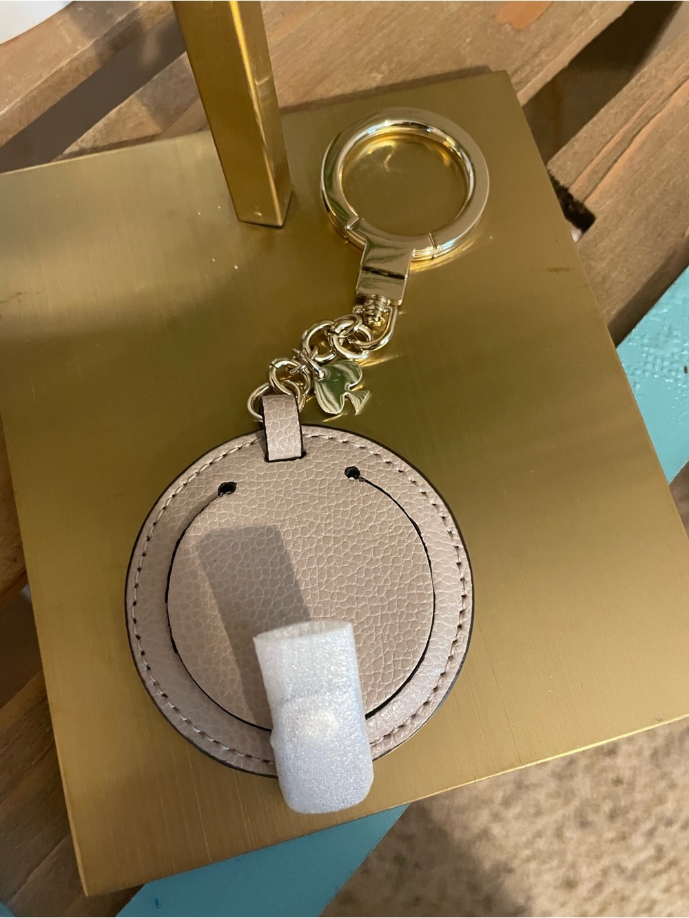 Kate Spade Gold Keyring with Taupe Leather Round Charm And Mirror